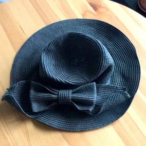 Black straw hat with bow.